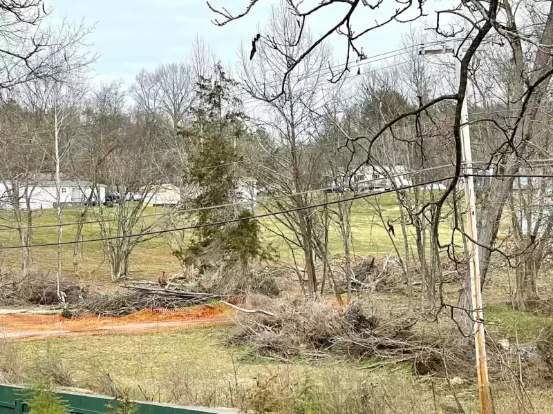 Neighbors  had to endure the unsightly view of decaying wood from their windows and back porches.